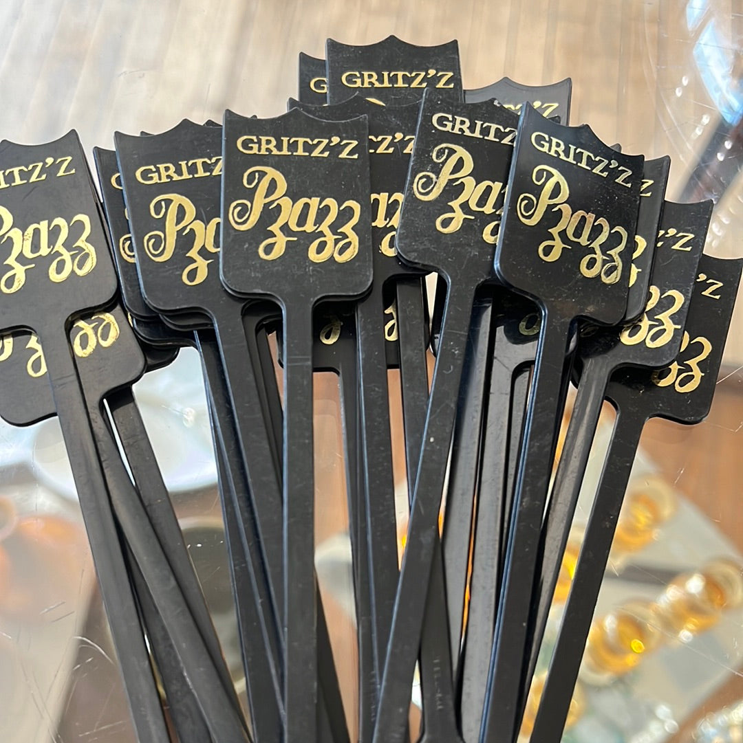 Black plastic drink stirrers