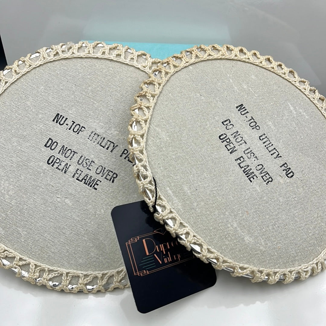 2 trivets with decorative crochet top