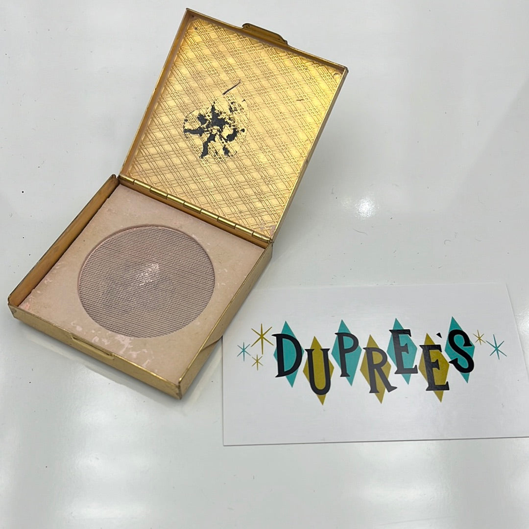 Powder compact