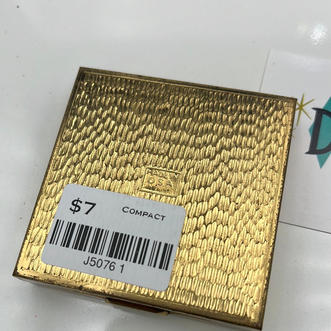 Powder compact