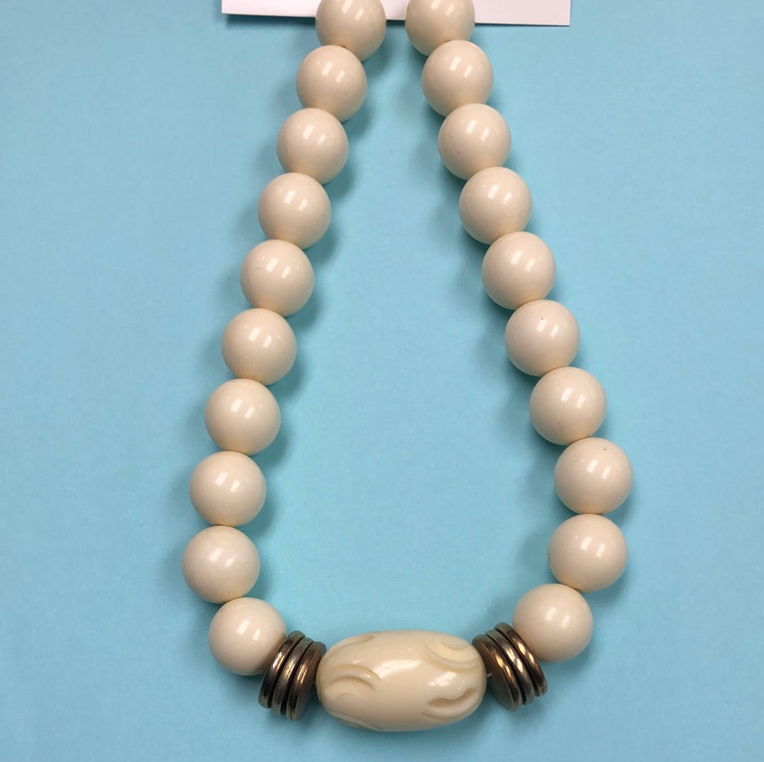 Ivory Round bead necklace with carved center barrel bead