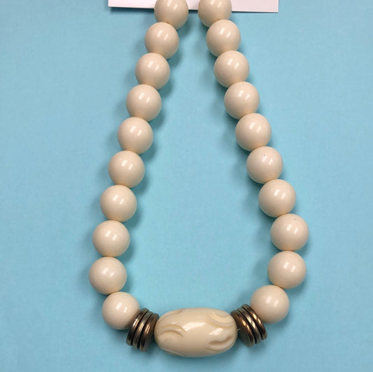Ivory Round bead necklace with carved center barrel bead