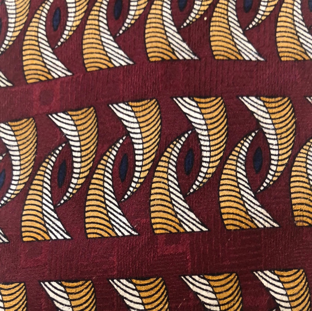 Maroon tie with gold and grey design