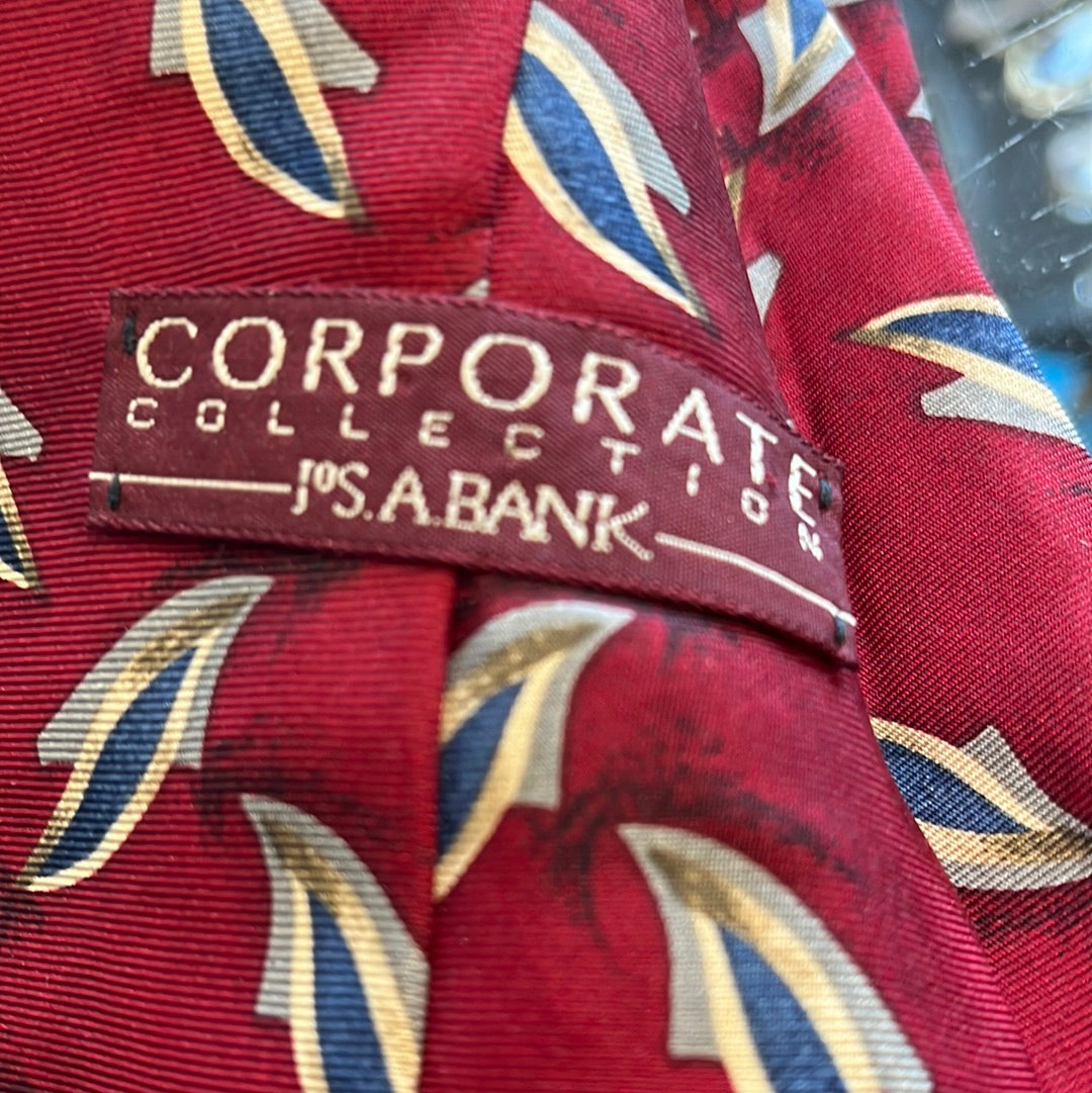 Red tie with diagonal pattern