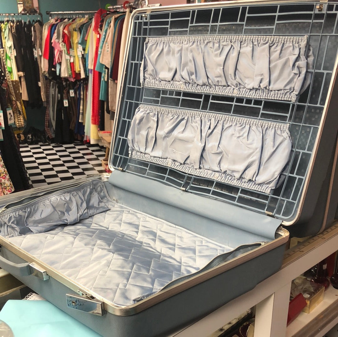 Large blue hard side suitcase