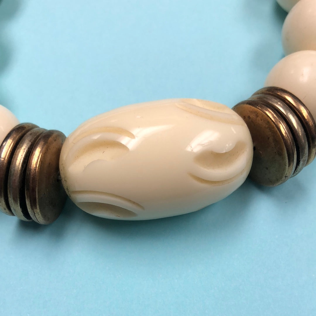 Ivory Round bead necklace with carved center barrel bead