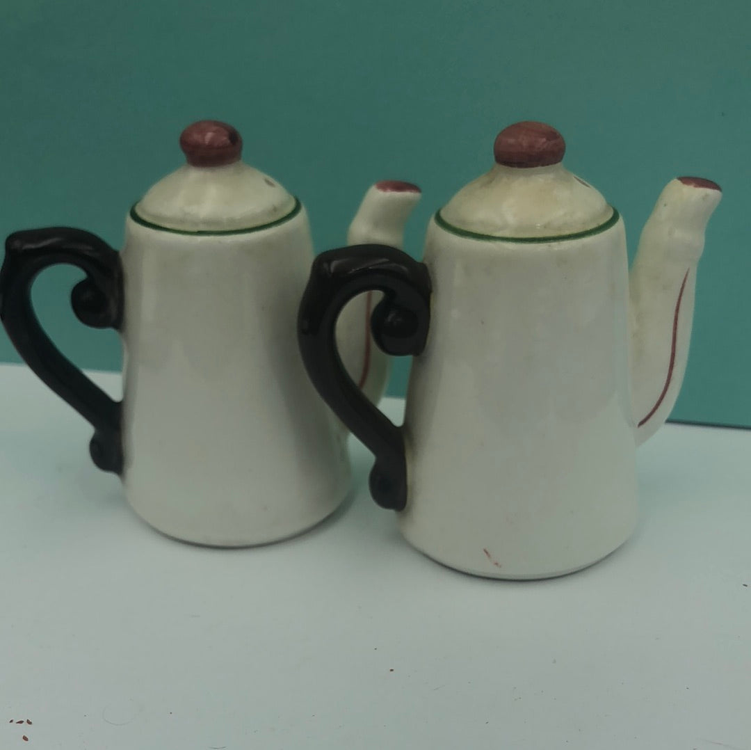 White tall teapot with floral design salt and pepper shaker
