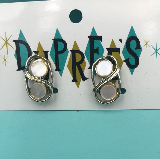 2 round pieces of shell surrounded by silver clip on earrings