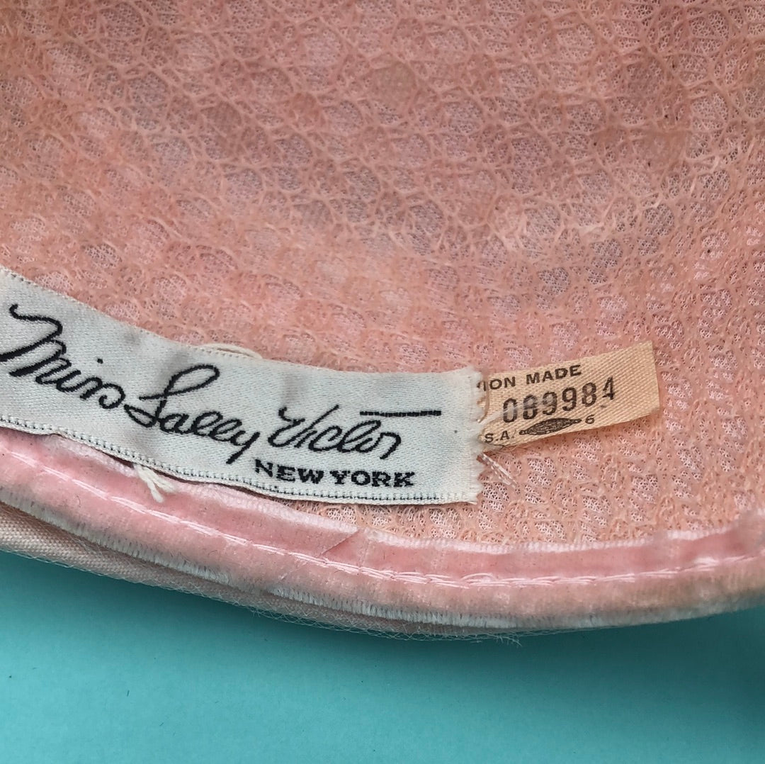 Pink fabric and tulle hat with combs