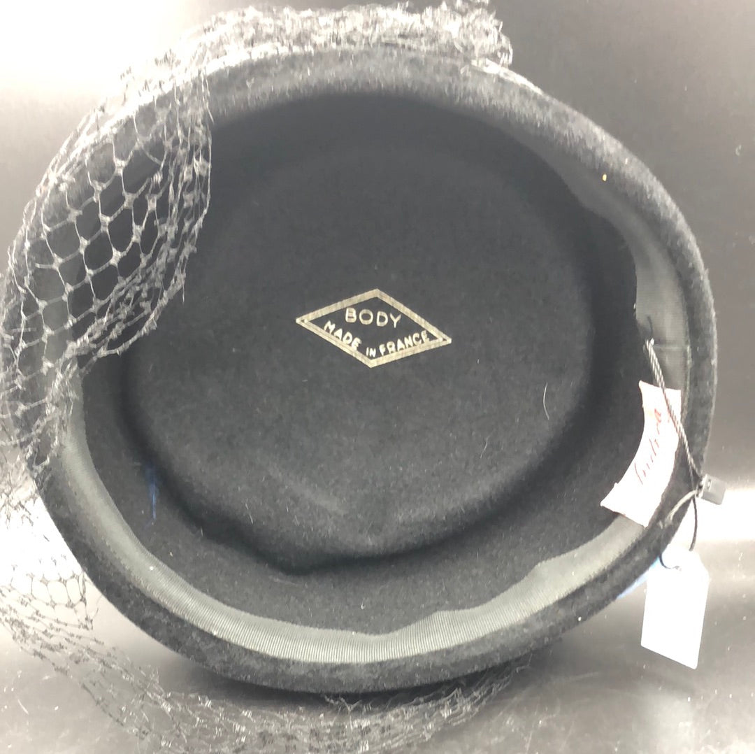 Black velvet hat with brim detail and black net