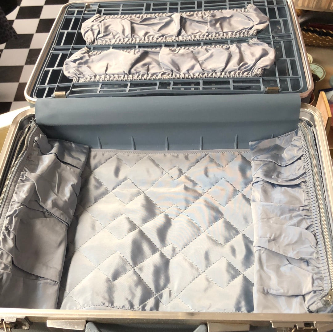 Small blue hardside suitcase