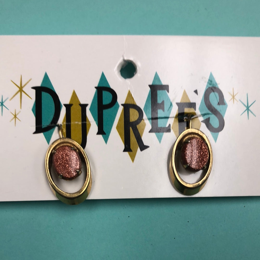 Copper sparkle oval with Gold setting