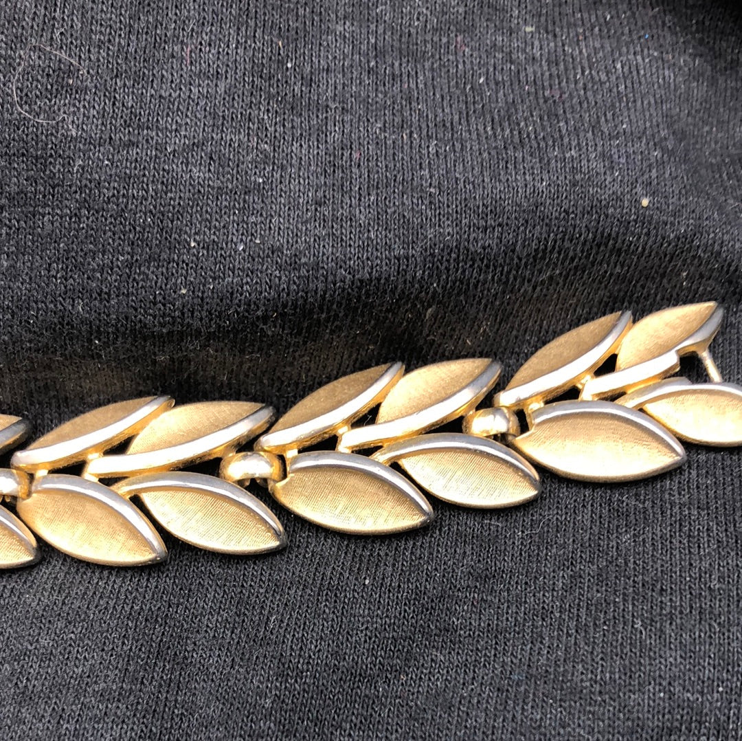 Gold elliptical shaped link bracelet and matching clip on earrings