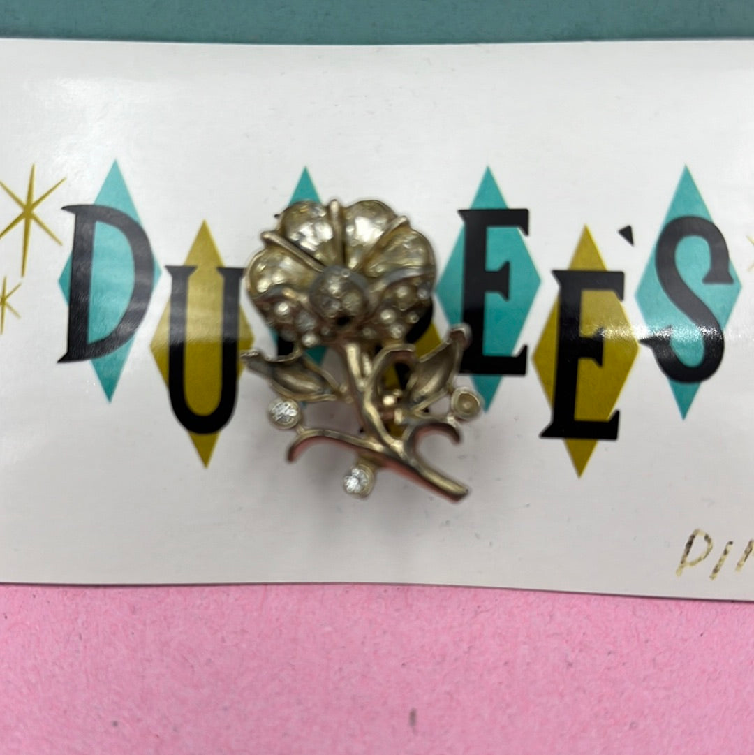 Silver flower pin embellished with clear crystal