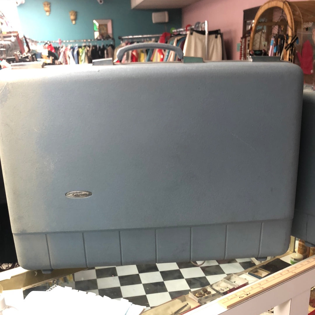 Large blue hard side suitcase