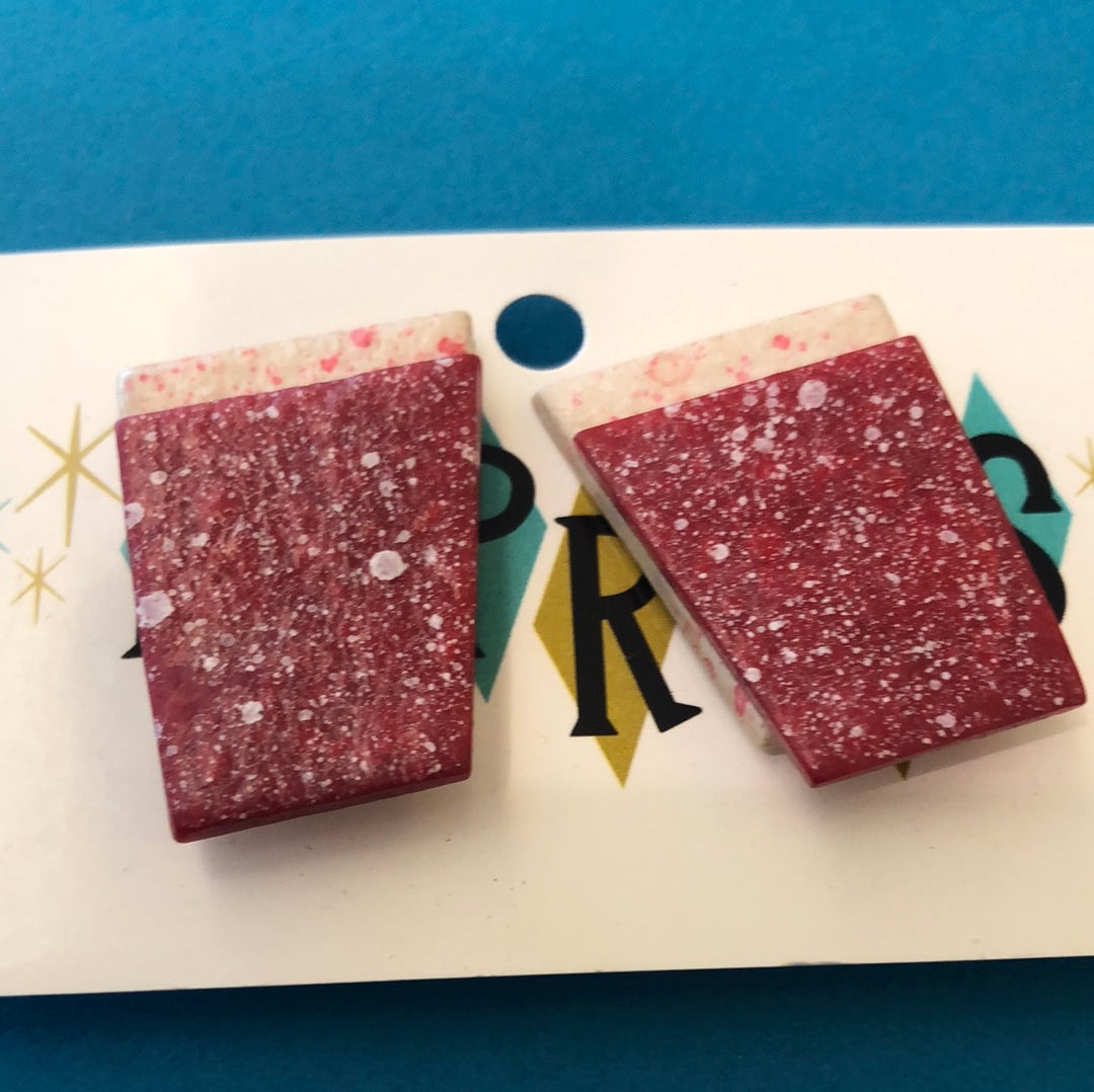 Red speckled clip on earrings