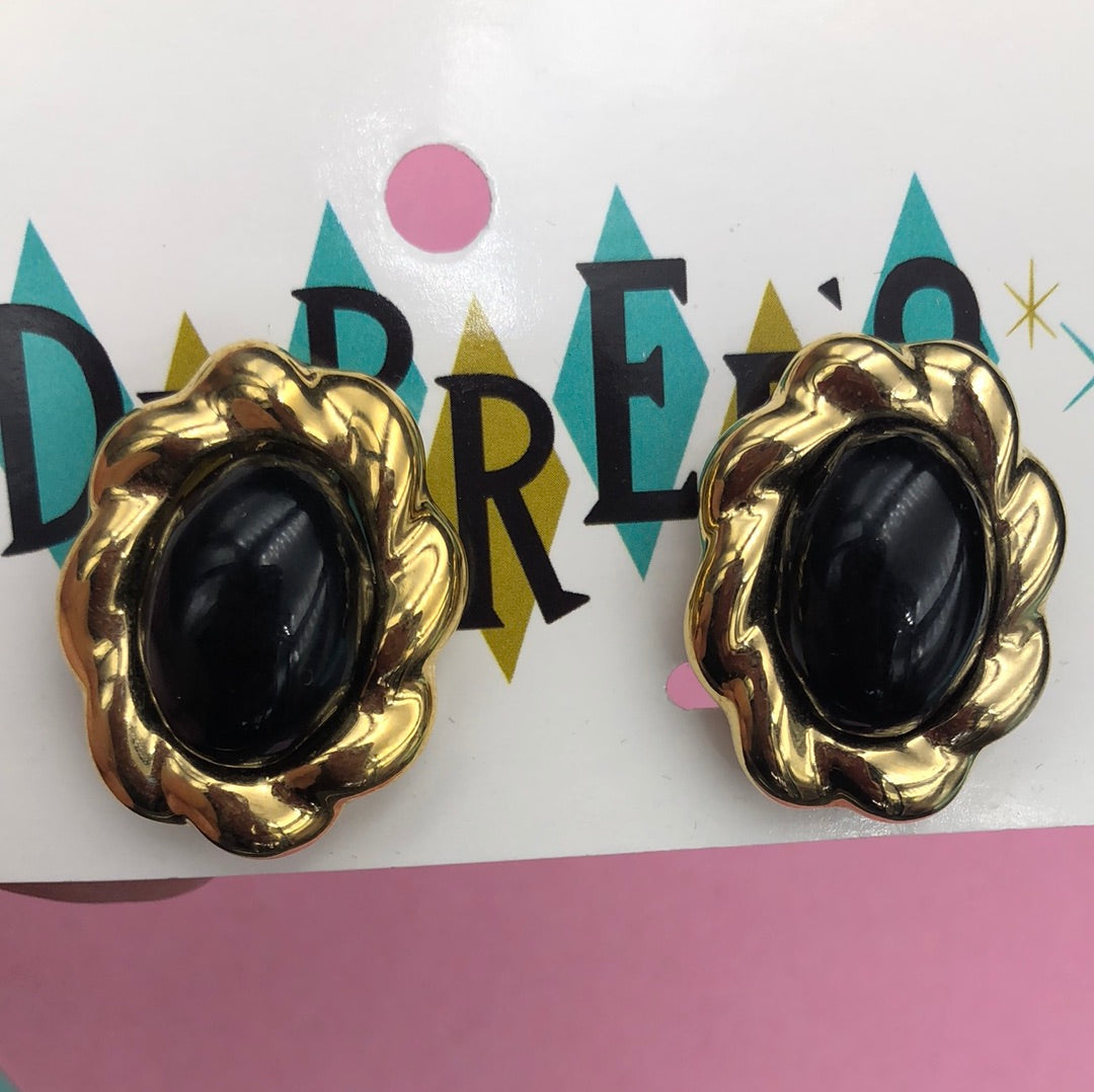 Gold oval clip on earring with Black center