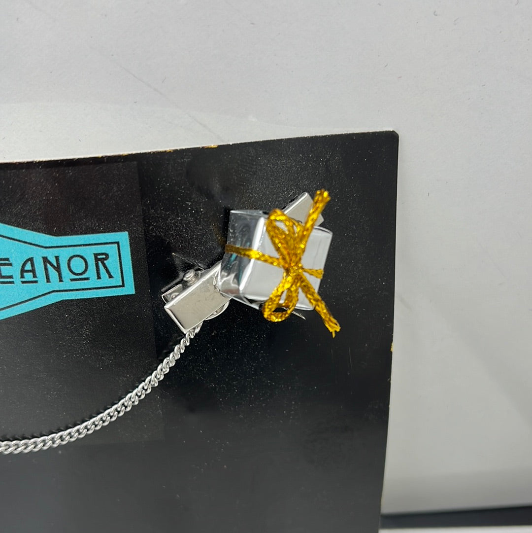 Silver package sweater clip