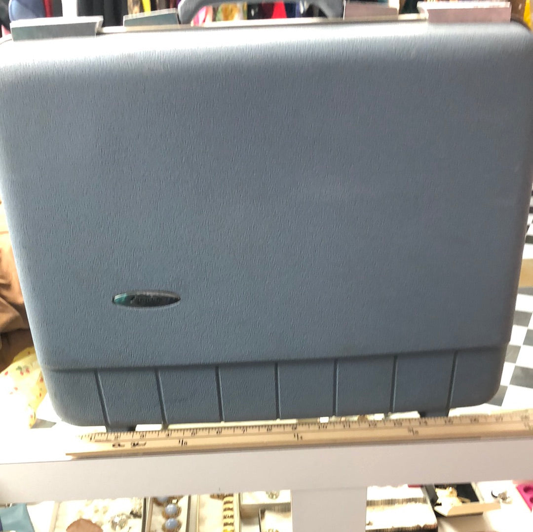 Small blue hardside suitcase