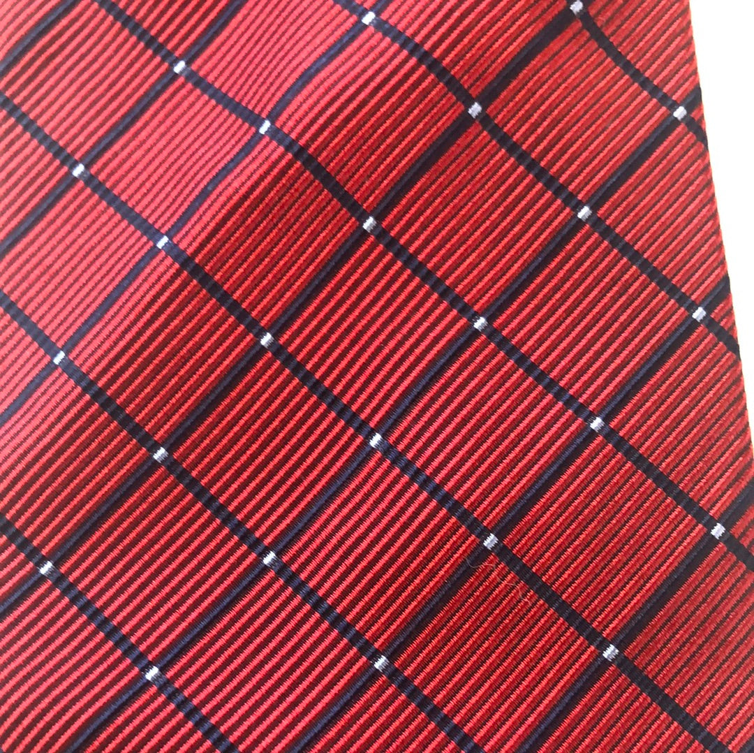 Red tie with diagonal diamond pattern