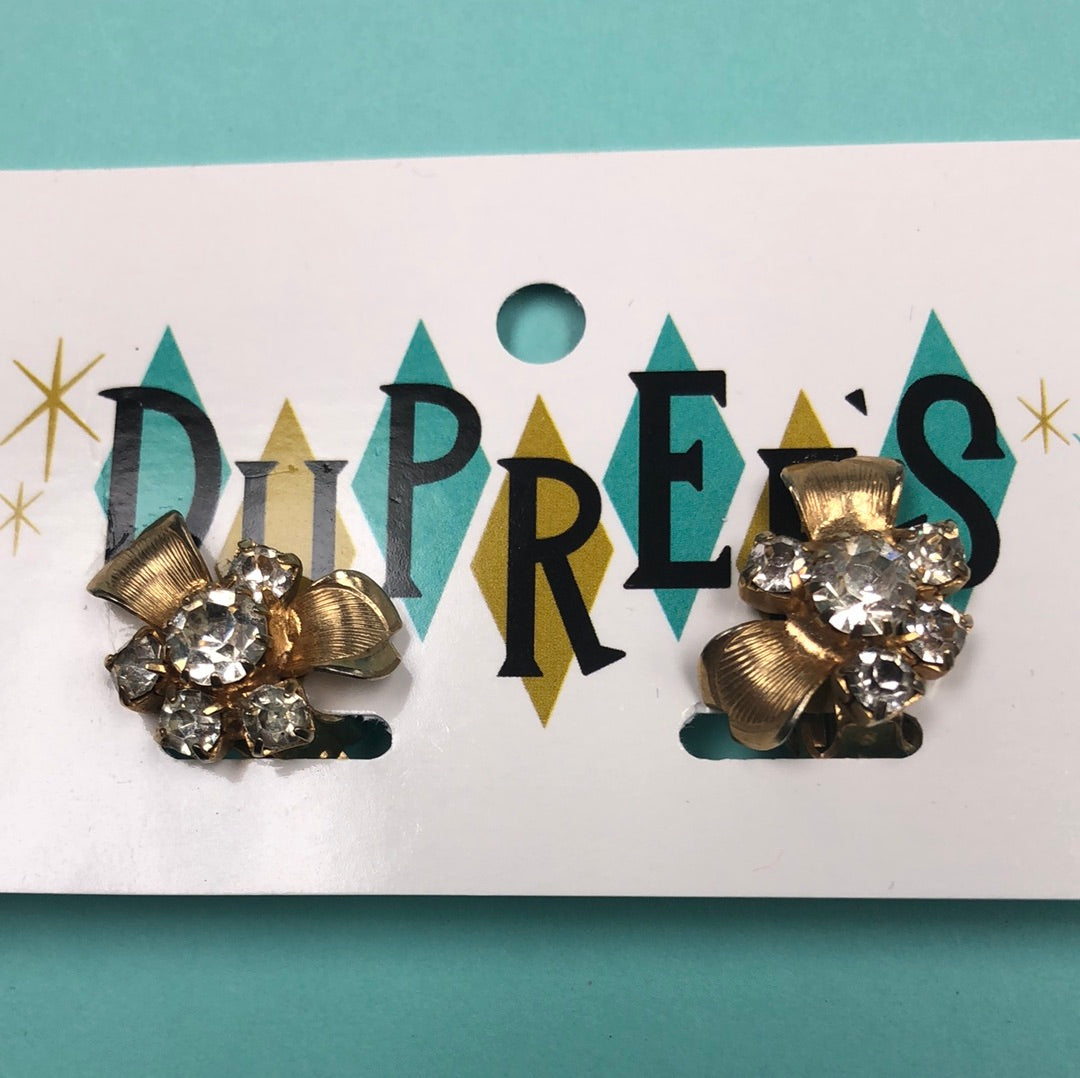 Gold flower with clear crystal accents and clip back earring