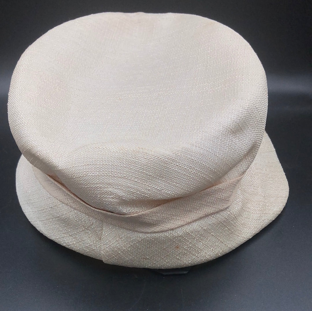 Beige textured fabric hat with bow