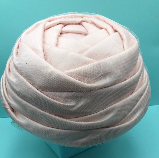 Pink fabric and tulle hat with combs