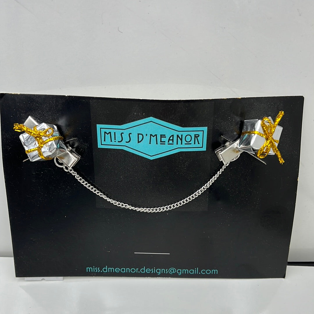 Silver package sweater clip