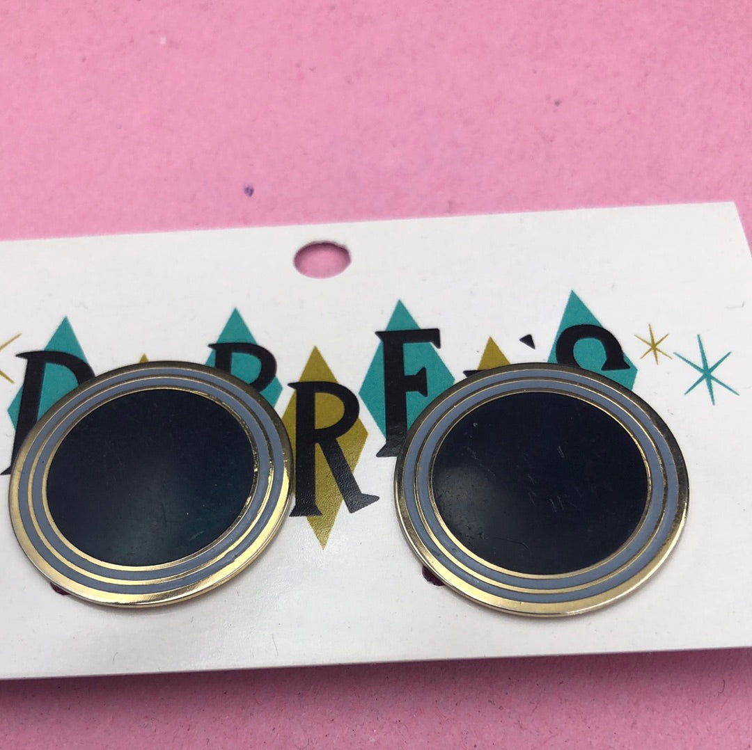 Flat metal disc with Gold and Navy Blue detail clip on earring