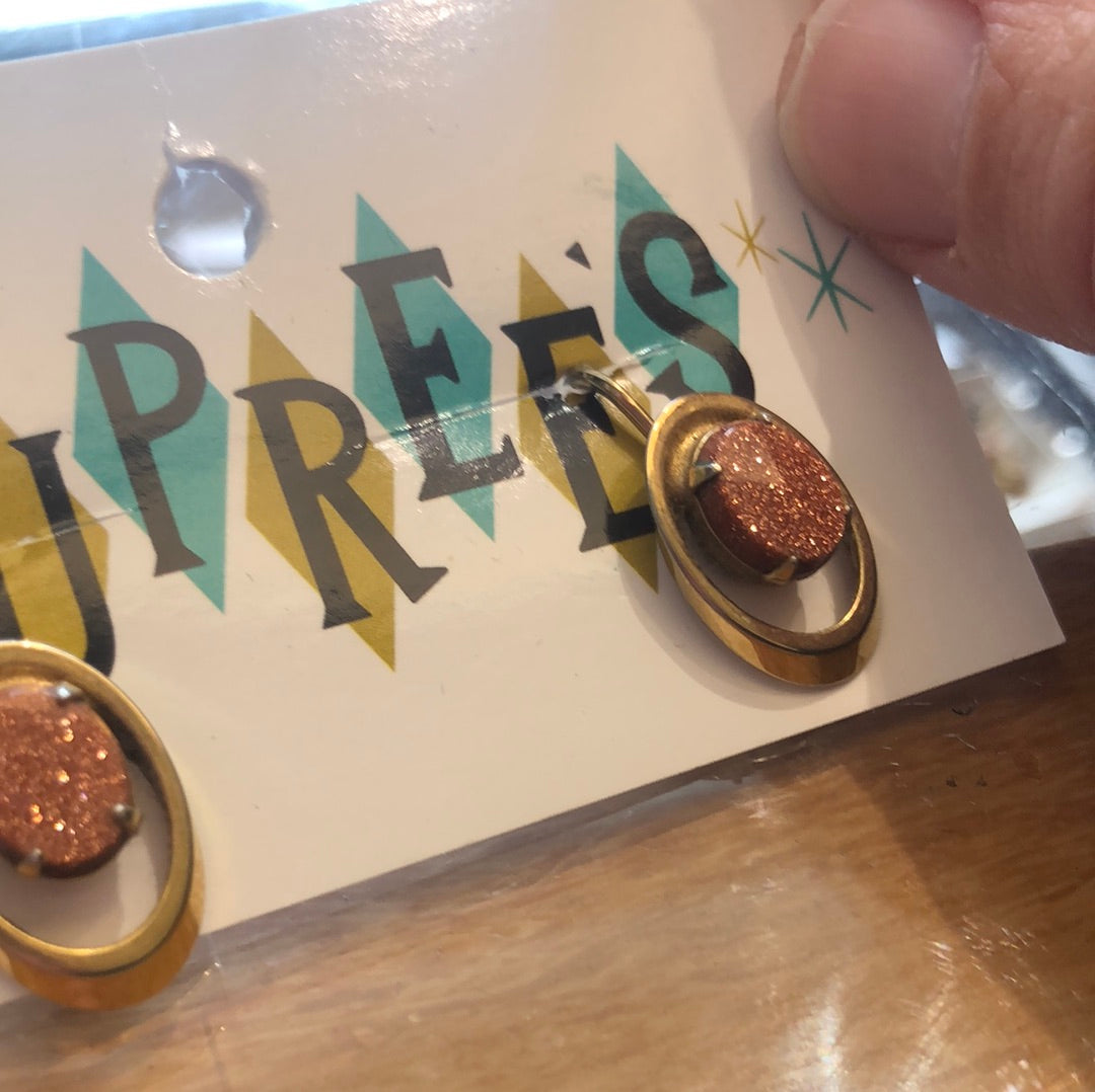 Copper sparkle oval with Gold setting