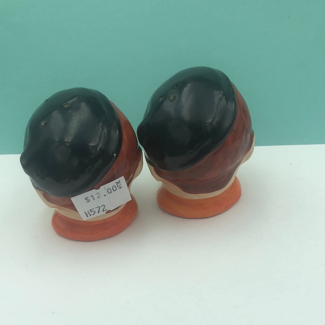 Man with beret salt and pepper shakers