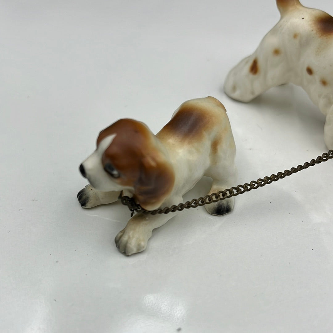 3 ceramic dogs leashed together