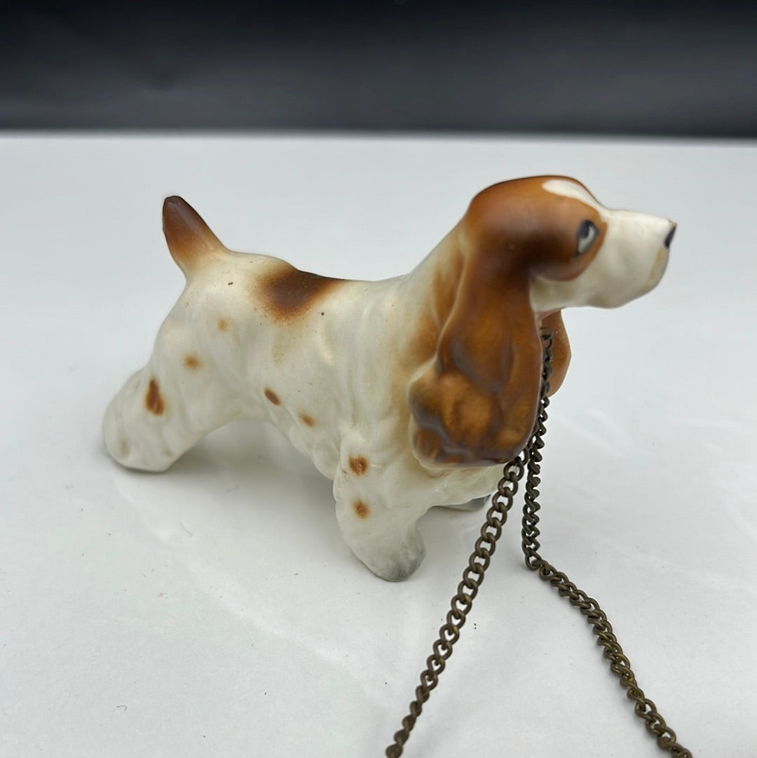 3 ceramic dogs leashed together