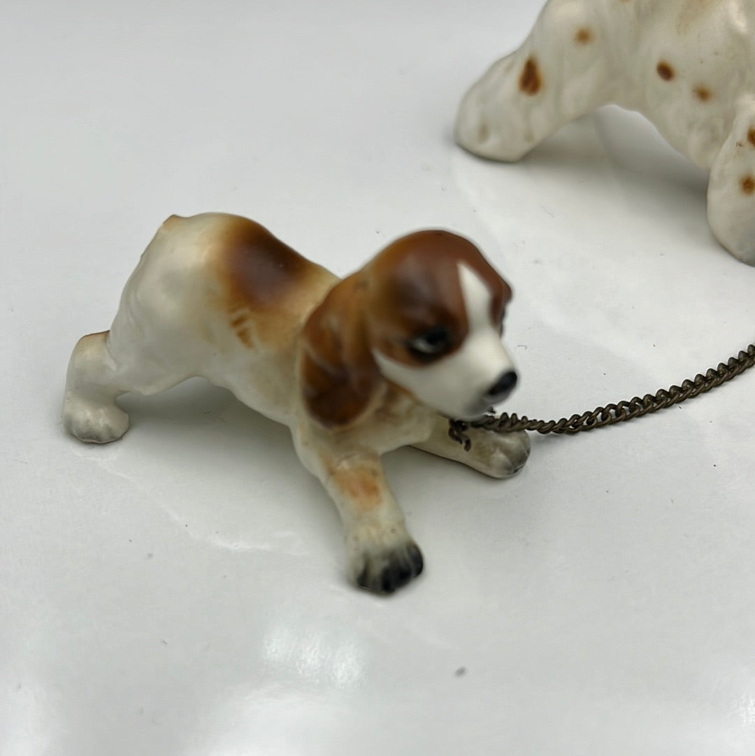 3 ceramic dogs leashed together