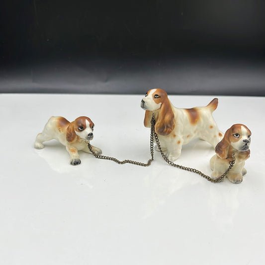 3 ceramic dogs leashed together