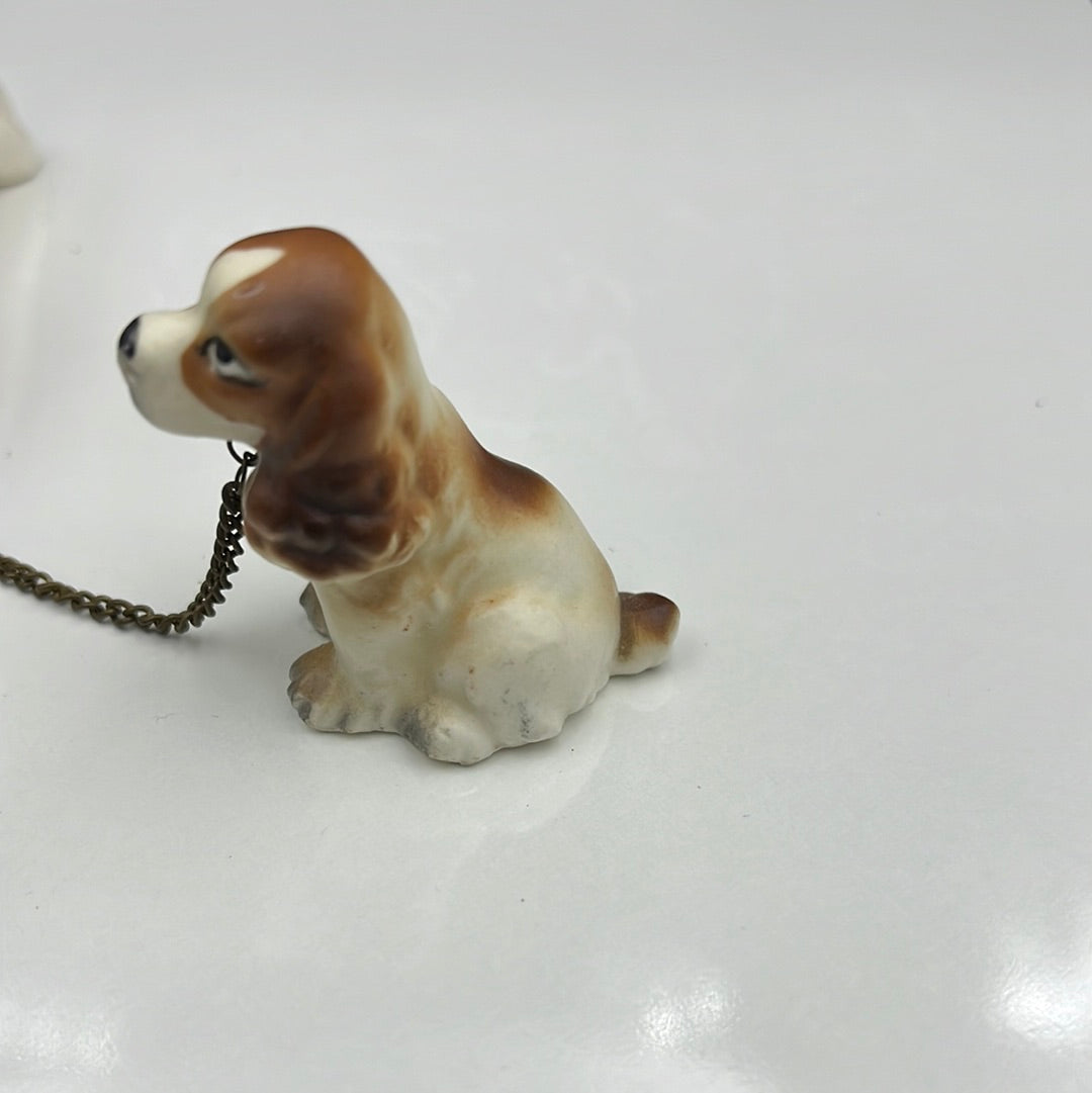 3 ceramic dogs leashed together