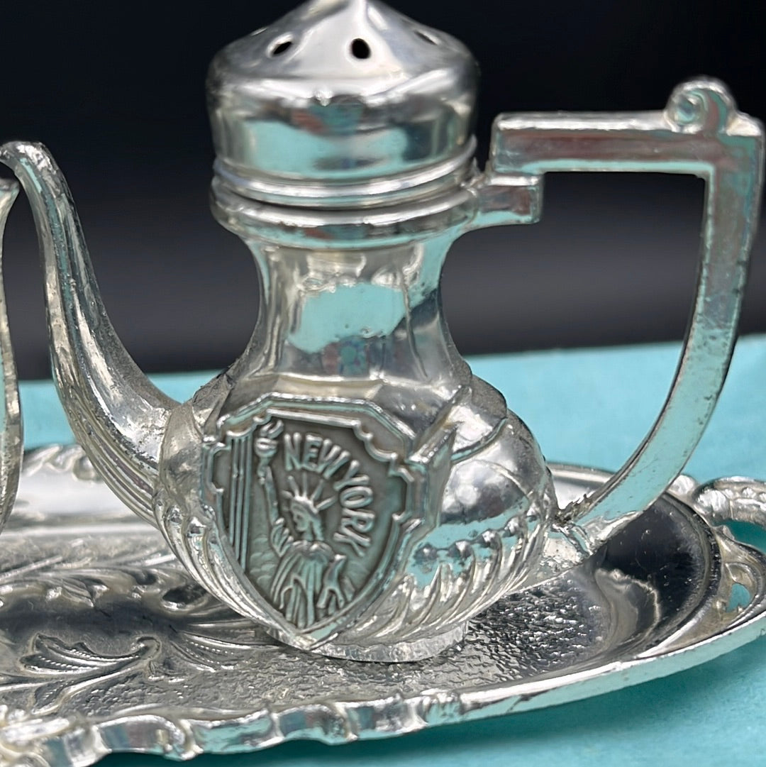 Silver teapot and tray salt and pepper shakers