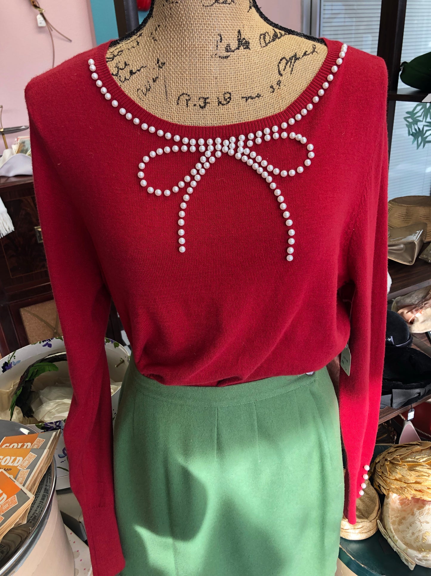Red sweater with pearl bow collar