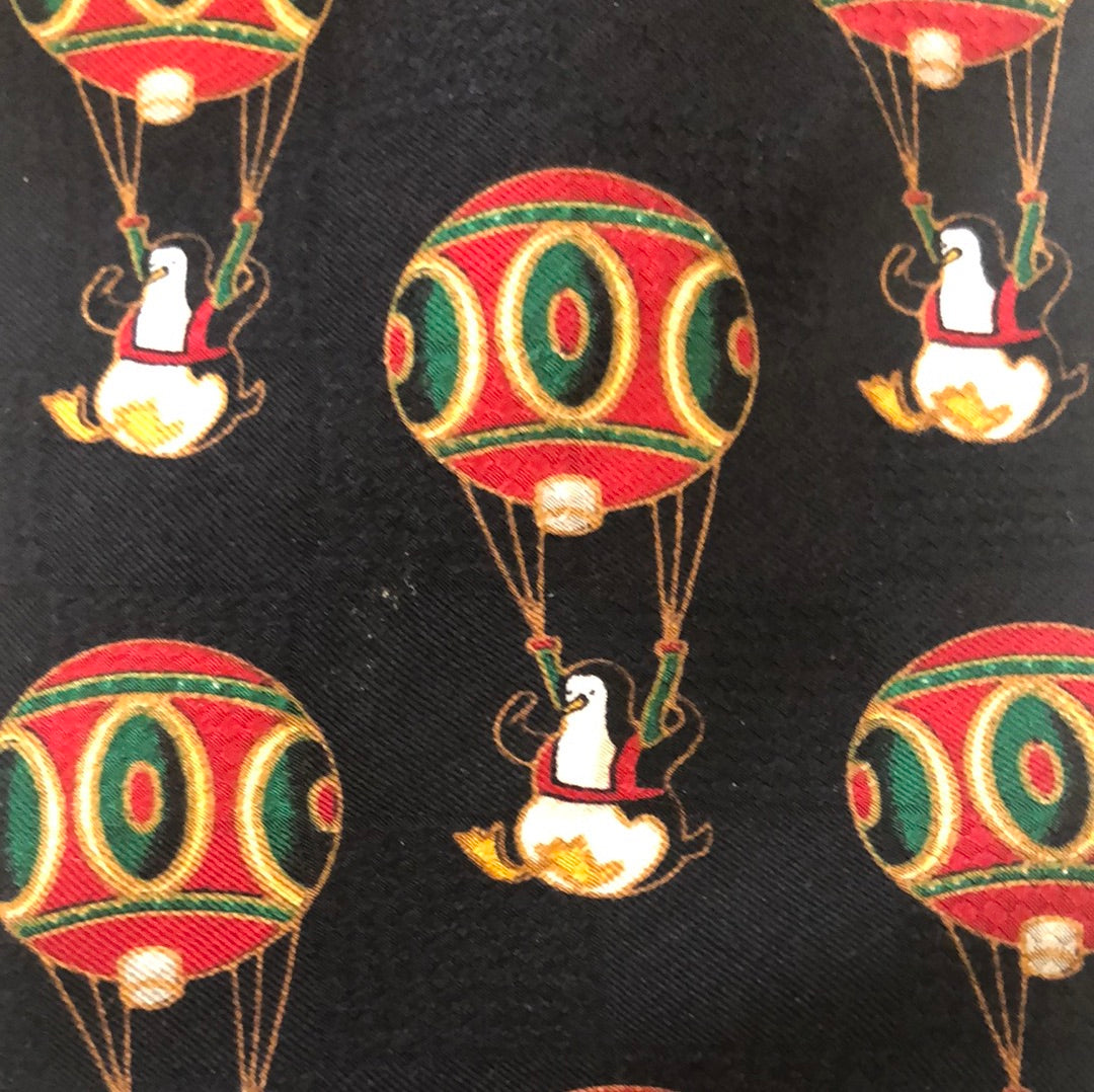 Black tie with penguin and hot air balloon pattern