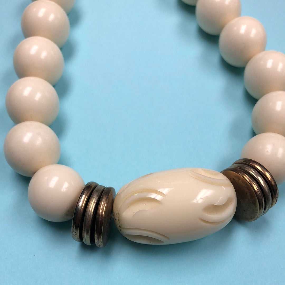Ivory Round bead necklace with carved center barrel bead