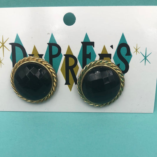 Black faceted round pierced earrings with gold trim