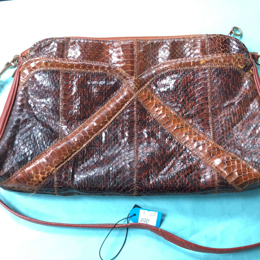 Brown snake skin pattern purse with leather handle