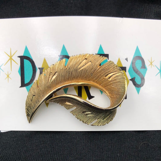 Gold feather brooch