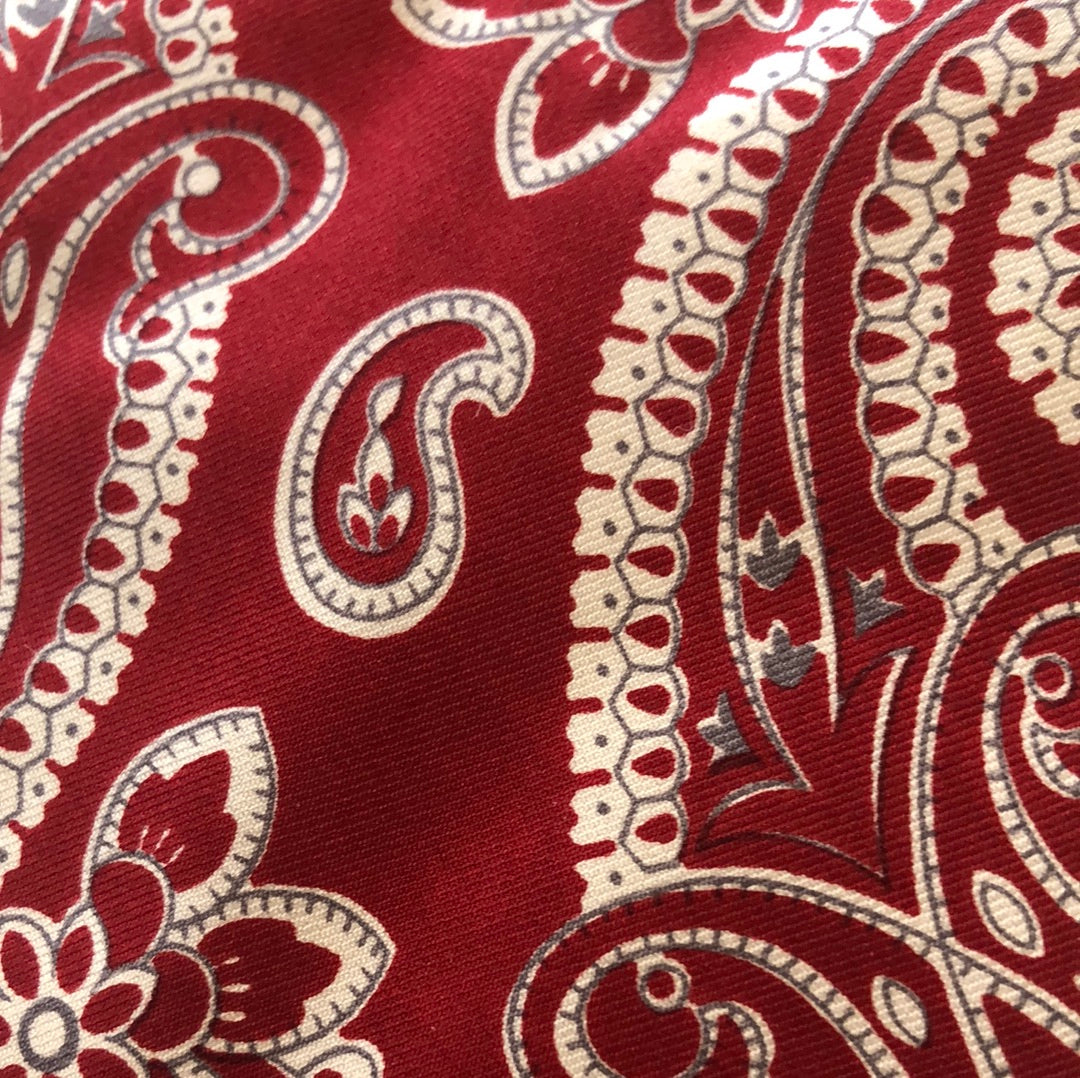 Red tie with large paisley design