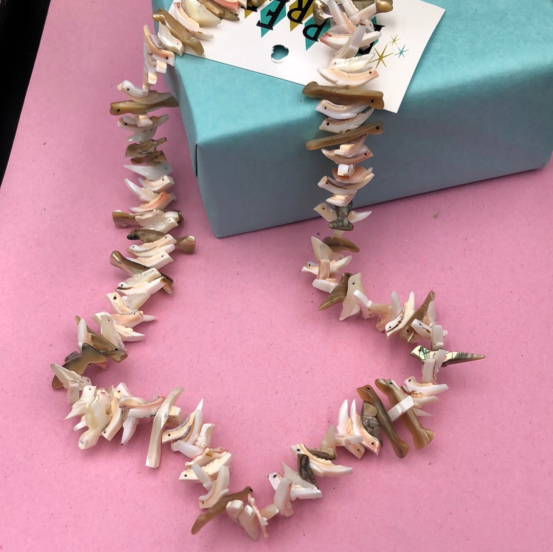 Bird carved Puka Shell necklace