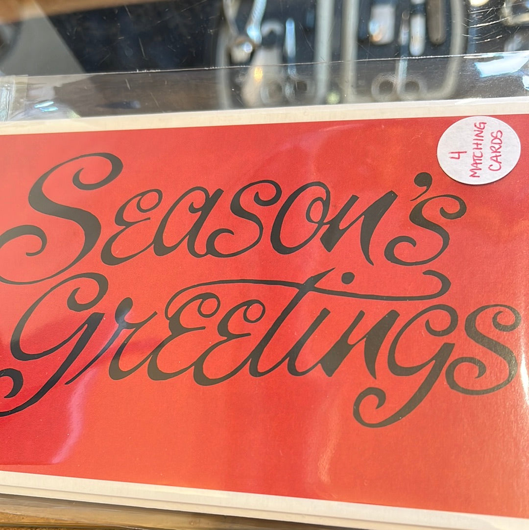 4 pack of red cards that say Season’s  Greetings