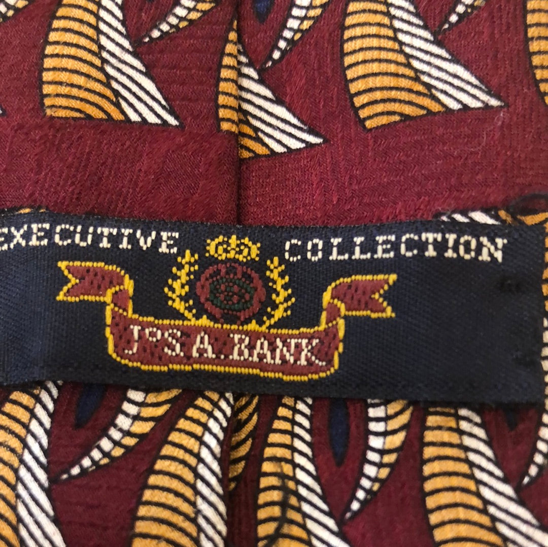 Maroon tie with gold and grey design