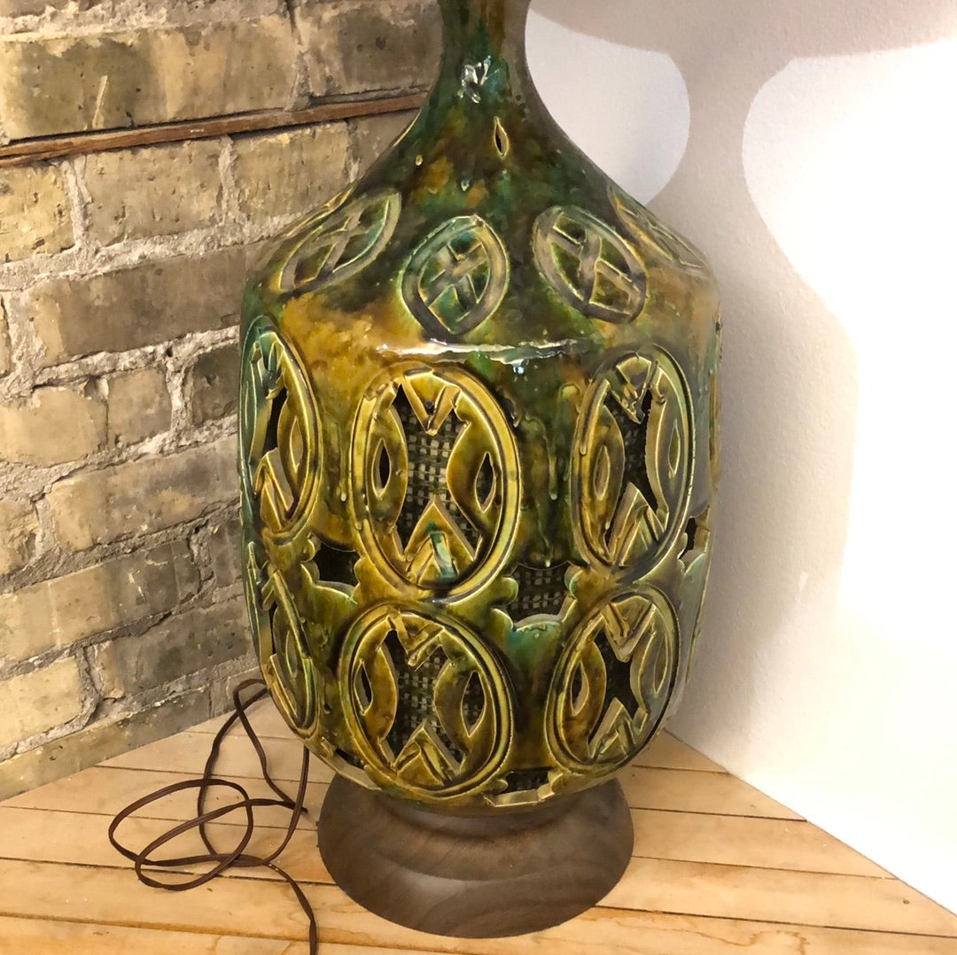 Green ceramic lamp with cutouts