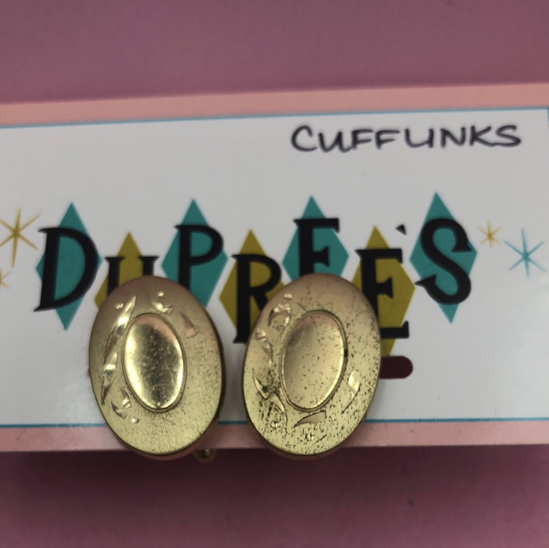 Gold oval cuff links