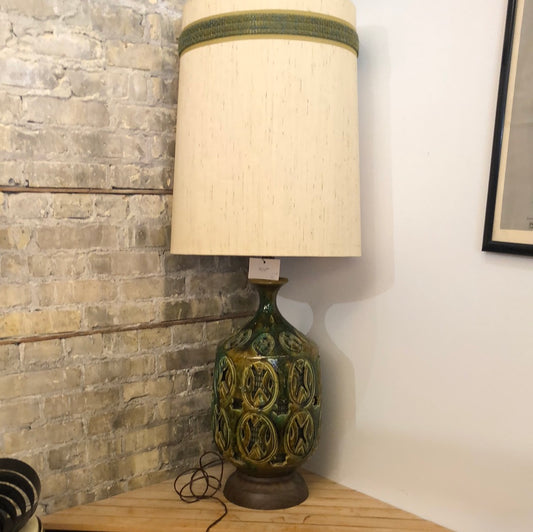 Green ceramic lamp with cutouts